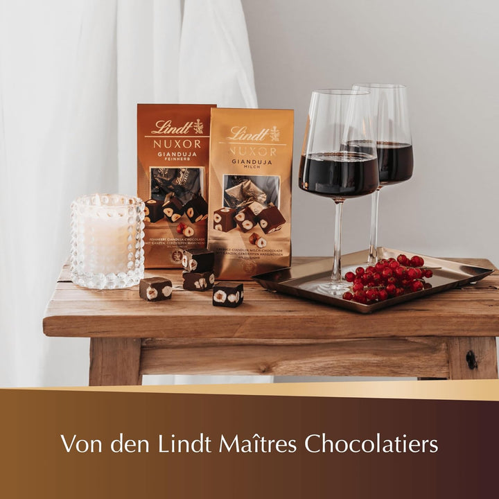 Lindt Schokolade NUXOR Weiss, Promotion | 103G Beutel | Cremige Weisse Schokolade Mit Ganzen, Gerösteten Haselnüssen | Pralinen-Geschenk | Schokoladengeschenk